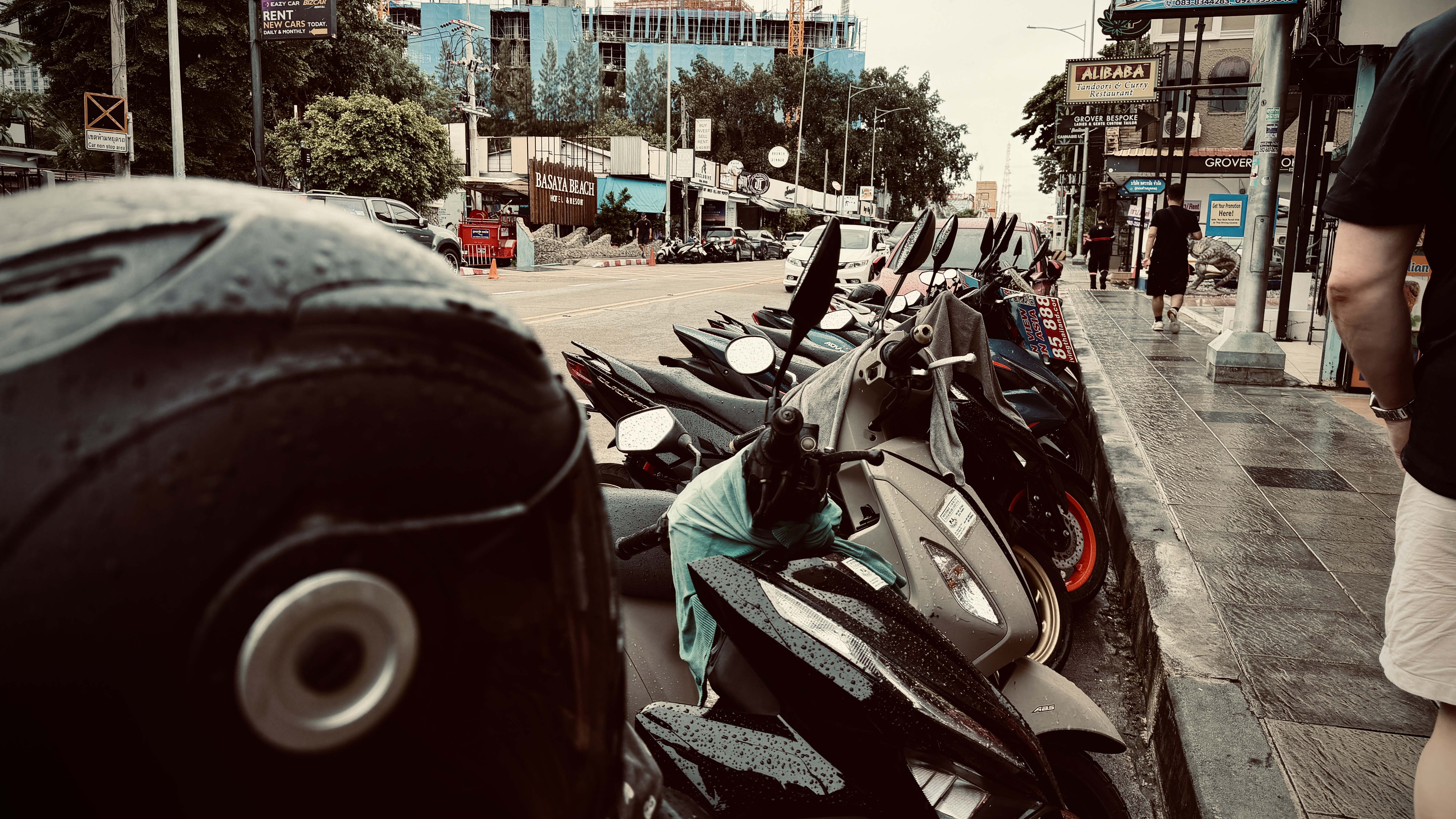 Rows of parked scooter line the street